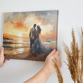 Framed canvas print of a couple embracing on a beach at sunset with vibrant warm colours and soft lighting