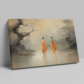 Framed canvas print of monastic figures in saffron robes by a misty river amidst autumn trees
