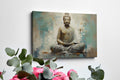 Canvas print of a meditating Buddha in beige and turquoise hues conveying serenity and spirituality.