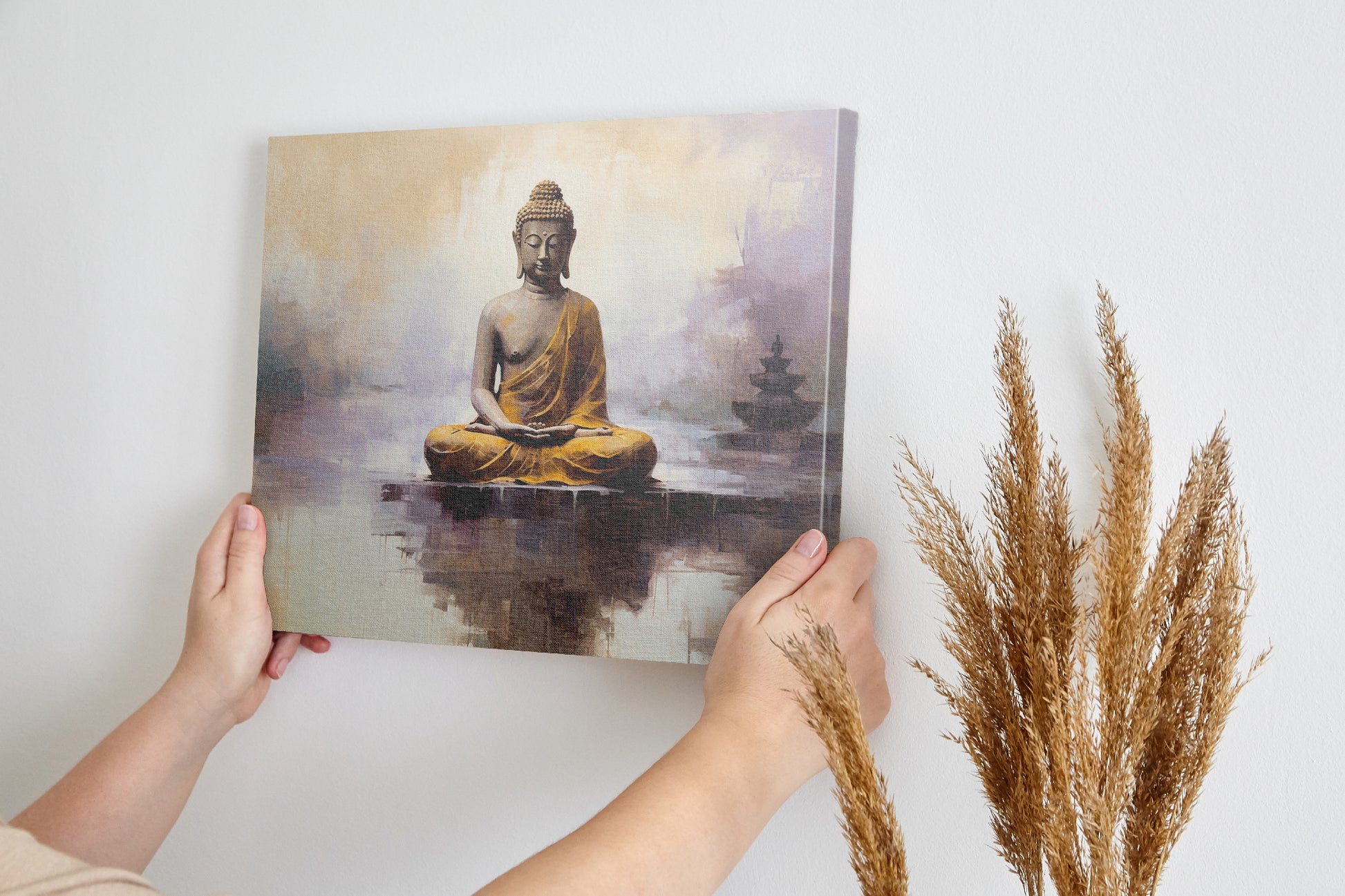 Framed canvas print of a meditative Buddha figure in golden and beige tones with a serene abstract background