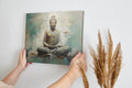 Canvas print of a meditating Buddha in beige and turquoise hues conveying serenity and spirituality.