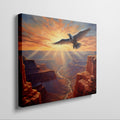 Framed canvas print of a majestic eagle soaring over a stunning canyon at sunset with radiant orange and red hues