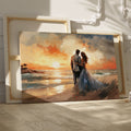 Framed canvas print of a couple embracing on a beach at sunset with vibrant warm colours and soft lighting