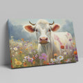 Framed canvas print of a realistic cow in a colourful meadow with wildflowers