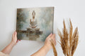 Framed canvas print of a meditative Buddha in serene, neutral tones