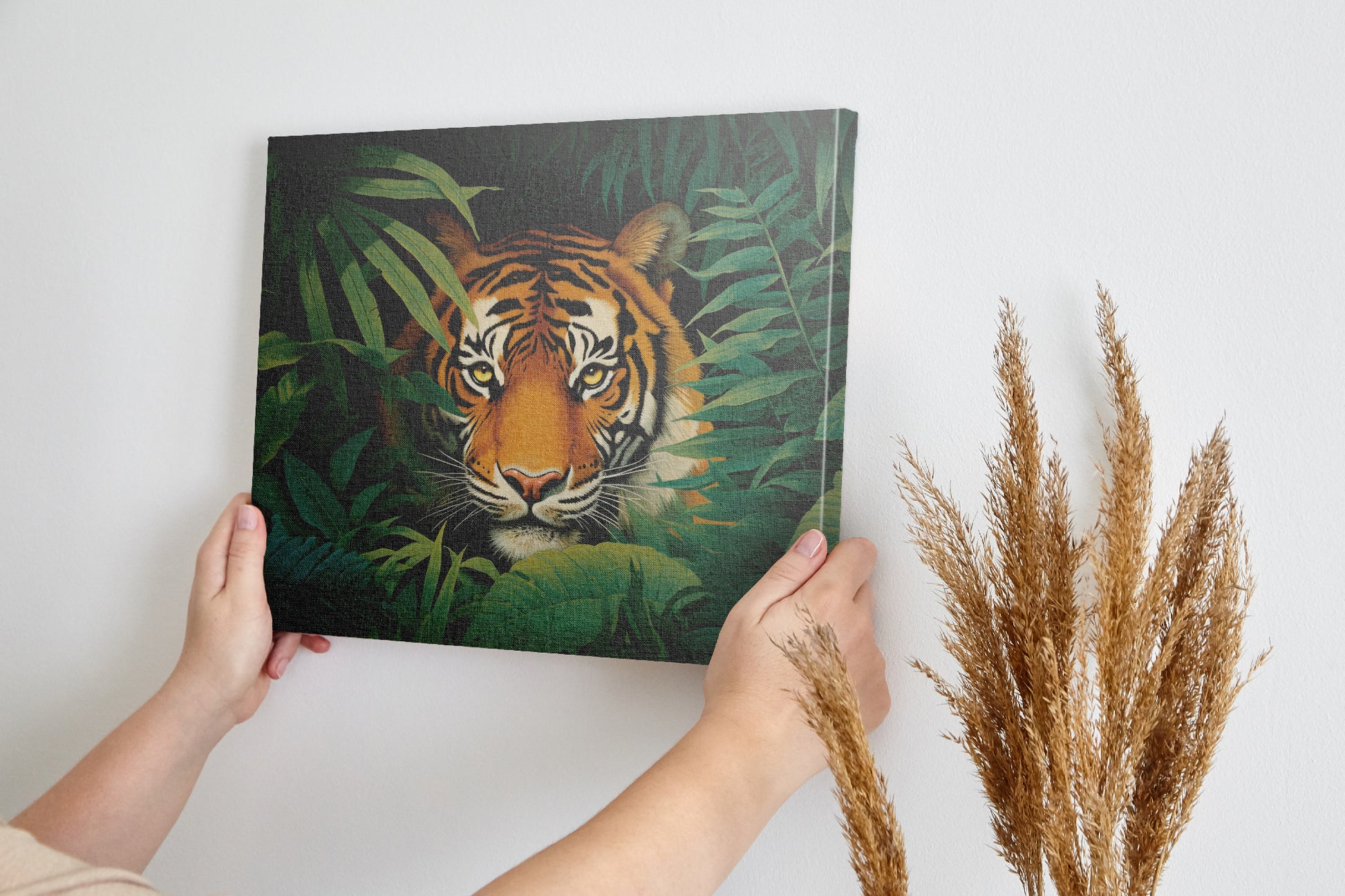 Canvas print of a tiger in a jungle with vivid green leaves around it