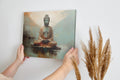 Framed canvas print of a serene Buddha in meditative pose with earthy tones