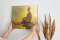 Framed canvas print of a golden Buddha in meditation