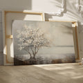 Textured painting of a tree with white flowers and its reflection on water, on a beige and brown background