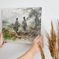 Watercolor painting of two figures in traditional attire walking through a natural landscape