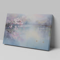 Framed canvas print of cherry blossoms over a tranquil lake with soft pastel colours and a pair of ducks