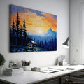 Framed canvas print of a mountain sunrise with a rustic cabin amongst pine trees