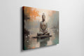 Framed canvas print of serene Buddha in meditative pose with abstract orange and blue background
