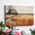 Framed canvas print of a rustic barn in autumn with golden fields and a stone pathway