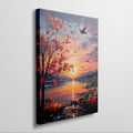 Framed canvas print of an impressionist-style autumn sunset by a lake with birds in flight and vibrant foliage.