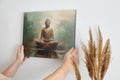 Framed canvas print of a meditative Buddha in earthy browns and soft blues