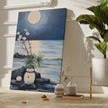 Blue and white moonlit seascape painting with flowers, rocks, and water