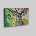 Framed canvas print of a colourful, modern artistic depiction of a stag with vibrant hues.