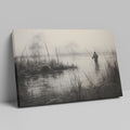 Framed canvas print of a fisherman in a foggy, monochrome lake landscape