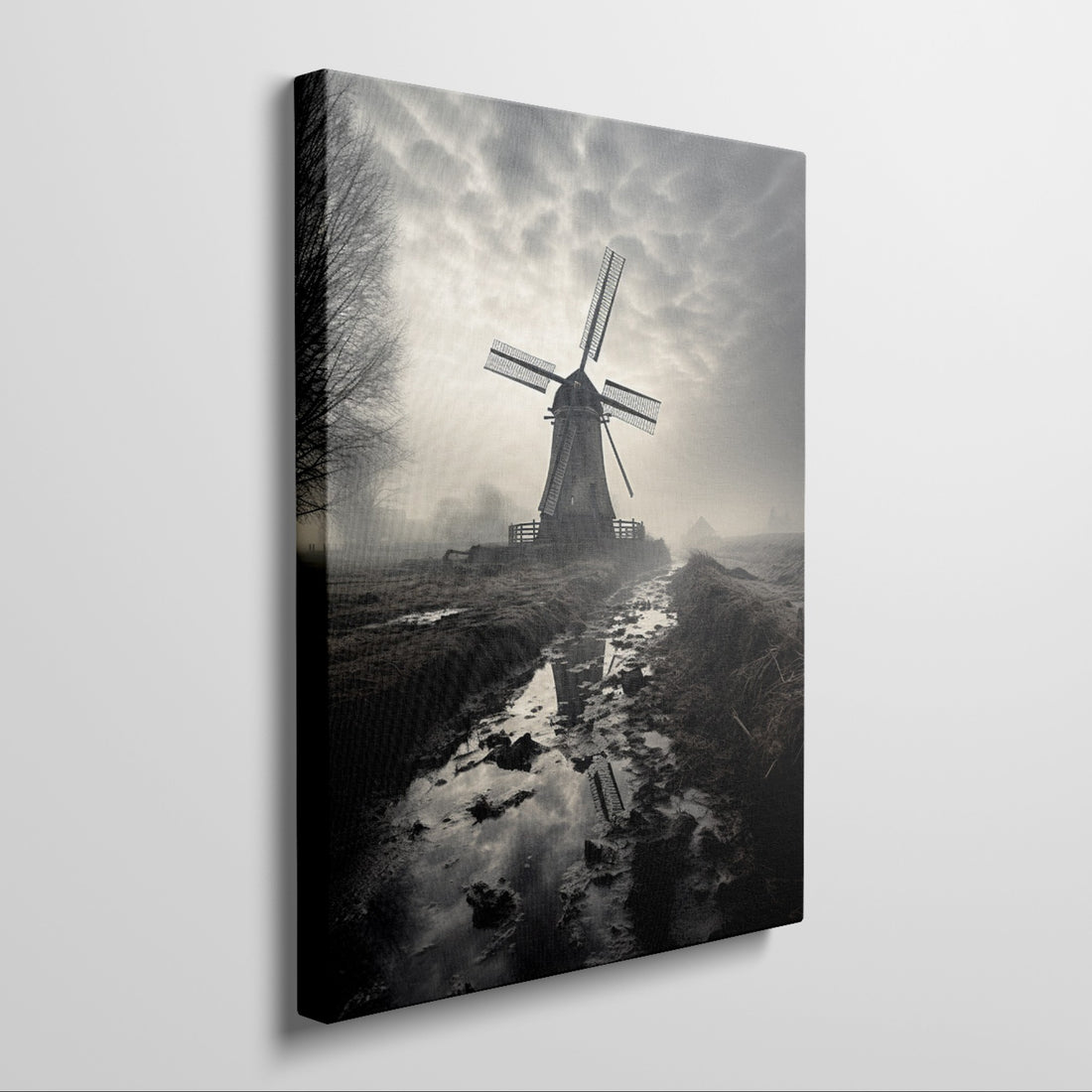 Framed canvas print of a misty Dutch windmill landscape with dramatic sky and reflection in puddle