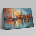 Framed canvas print of an abstract impressionistic sunset marina with a sailing boat and city silhouette