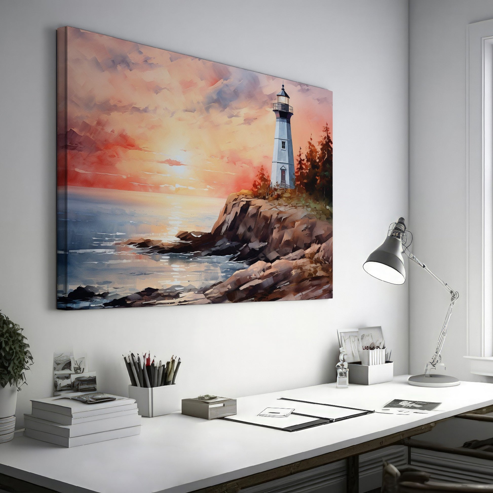 Framed canvas print of a watercolour lighthouse seascape at sunset with vibrant hues of pink, blue, and gold