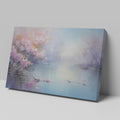 Framed canvas print of impressionist lakeside scene with blooming cherry blossoms and tranquil water reflections in pastel colours.