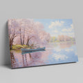 Framed canvas print of a serene river scene with cherry blossoms and a small boat