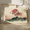 Framed canvas print of a serene cherry blossom tree amidst a minimalist mountain range