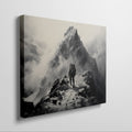 Framed canvas print of a lone mountaineer making their way up a foggy, monochromatic mountain scene