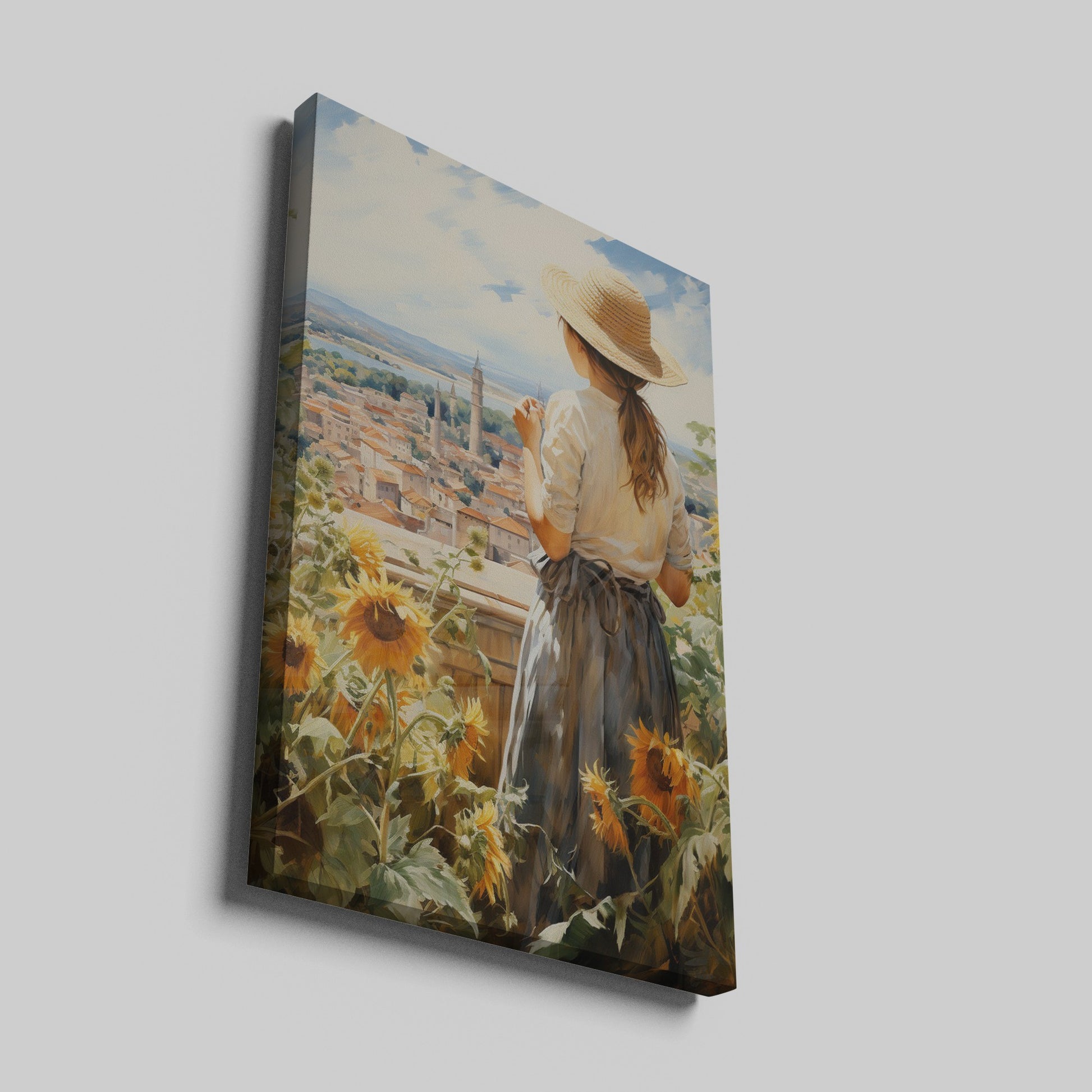 Framed canvas print of a woman gazing over a sunflower field and vintage town