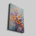 Framed canvas print of vibrant impasto style flowers with heavy texture in vivid orange and purple hues