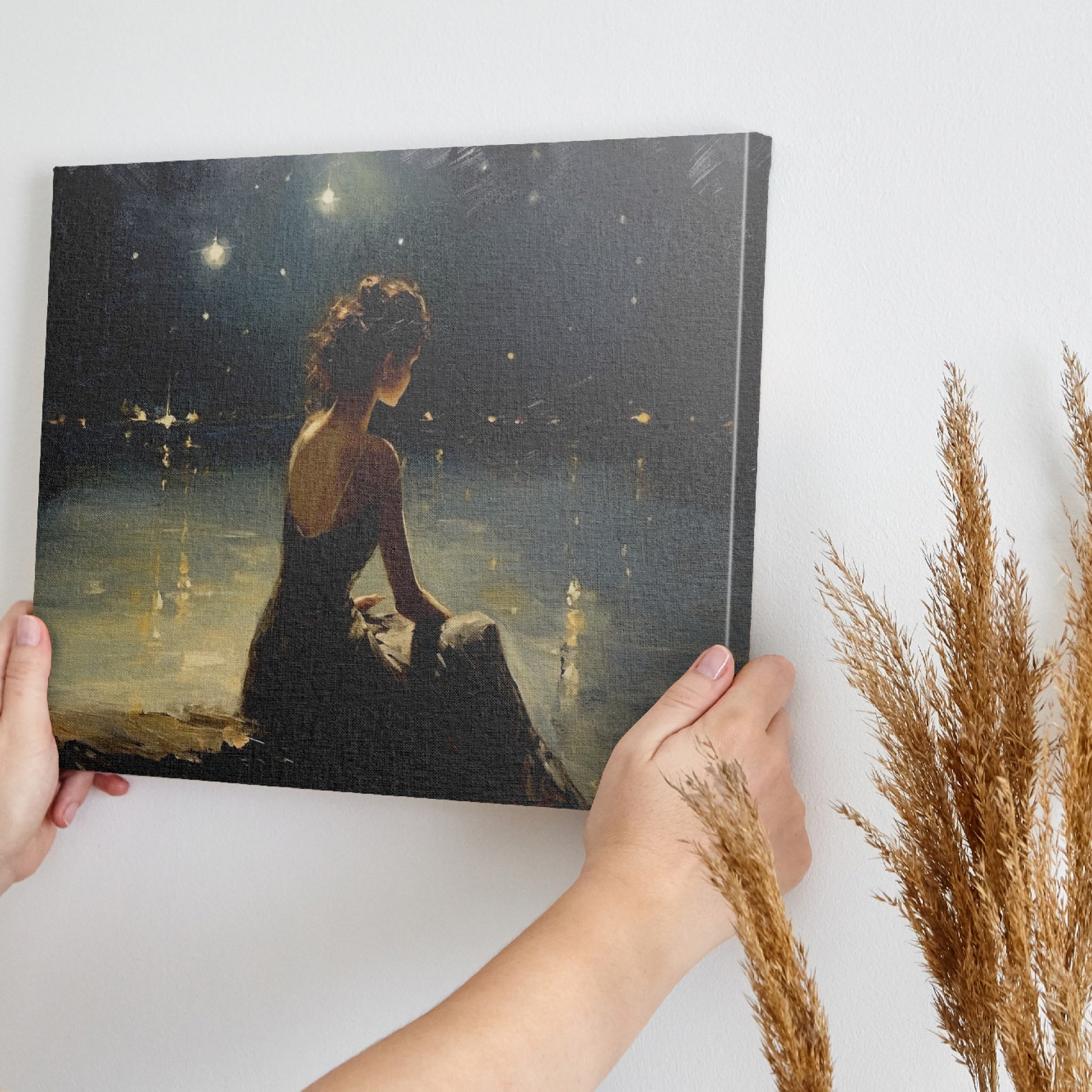 Framed canvas print of a woman in an evening dress admiring the reflective waters on a tranquil night