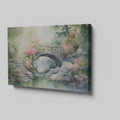 Framed canvas print of a serene stone bridge over a stream in a misty garden with lush greenery and flowering plants