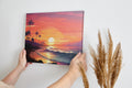 Framed canvas print of a digital tropical sunset with palm trees and ocean waves