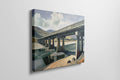 Framed canvas print of a serene countryside bridge over a river with mountain backdrop