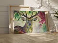 Framed canvas print of a vibrant stag with colourful floral surroundings