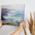 Framed canvas print of a vibrant impressionist seascape with cliffs and ocean waves