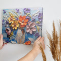 Framed canvas print of embossed and textured colourful flowers in impasto style