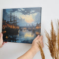 Framed canvas print of historical harbour at sunset with ships and city lights