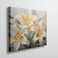 Framed canvas print of realistic sunlit yellow daylilies with lush green leaves