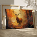 Framed canvas print of a majestic stag in a vivid autumn forest