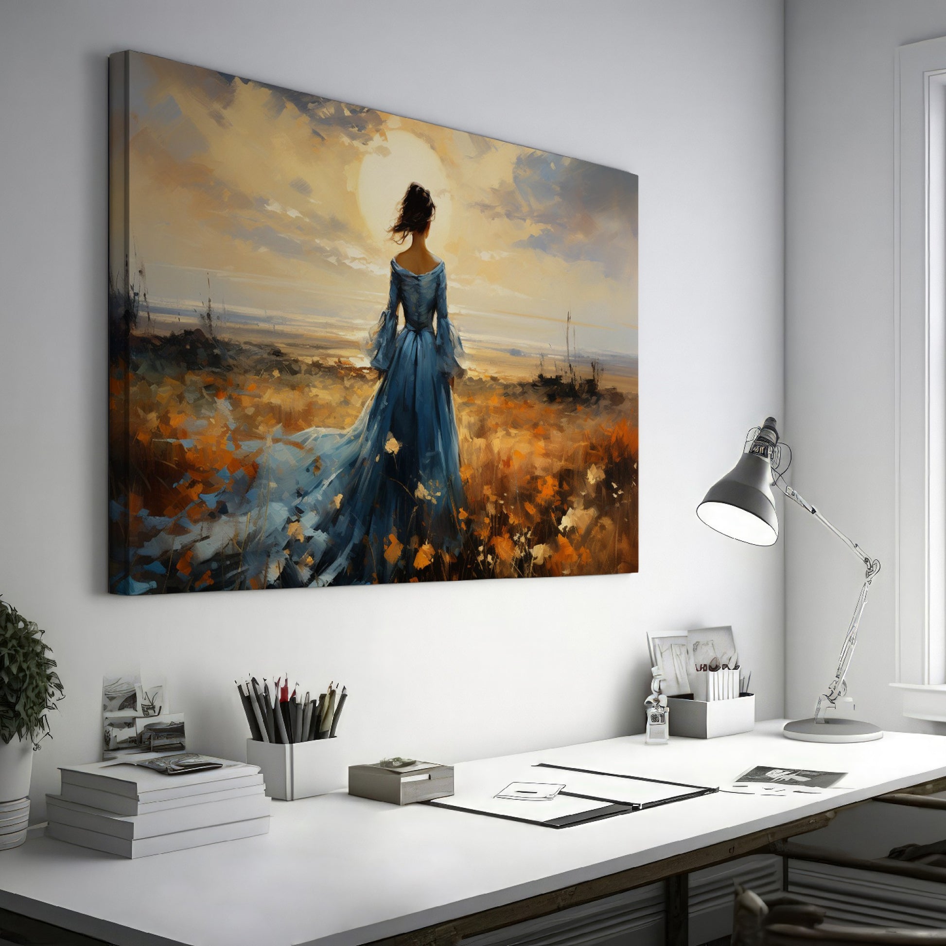 Framed canvas print of an elegant lady in a blue dress against a rural sunset backdrop with warm hues and a dramatic skyline