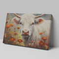 Framed canvas print of realistic cow in a floral setting with warm tones