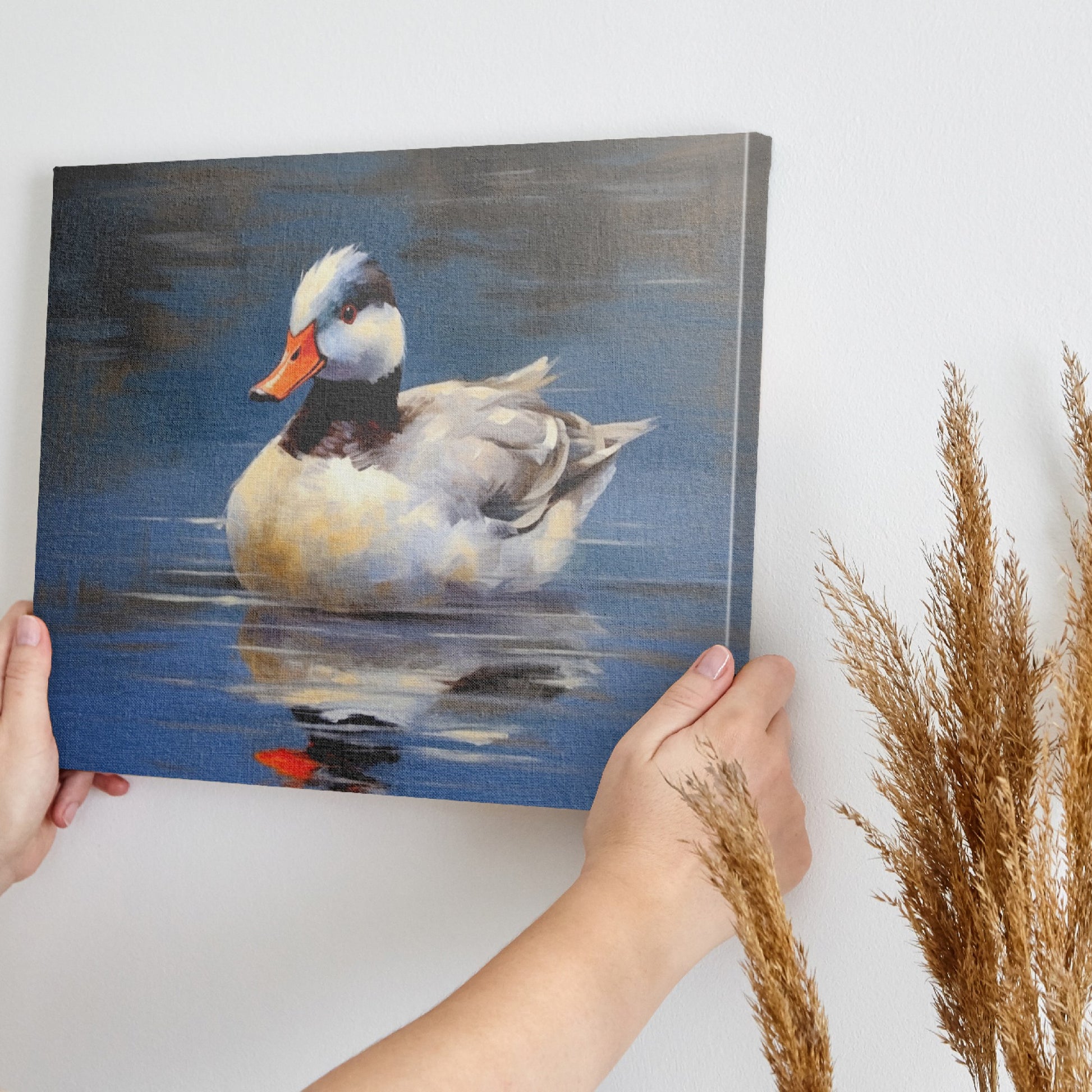 Framed canvas print of an impressionistic painting of a duck on water with blue tones