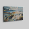 Framed canvas print of a serene watercolor painting depicting a scenic seaside landscape with vibrant blues and earthy tones