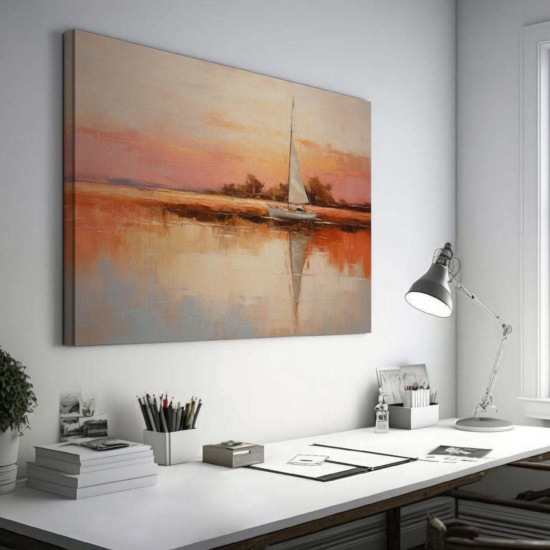 Framed canvas painting of a sailboat at sunset with orange and beige sky reflected in calm blue waters