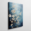 Framed canvas print of abstract blue and gold blossoms over a textured background