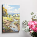 Framed canvas print of a vibrant rural landscape with a stream and cottage