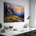 Framed canvas print of a rustic cabin at sunset with a mountainous backdrop